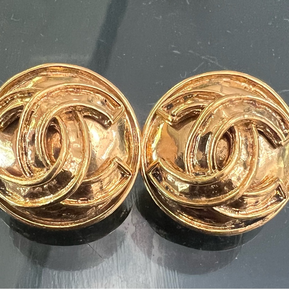 Chanel gold clip on earrings.